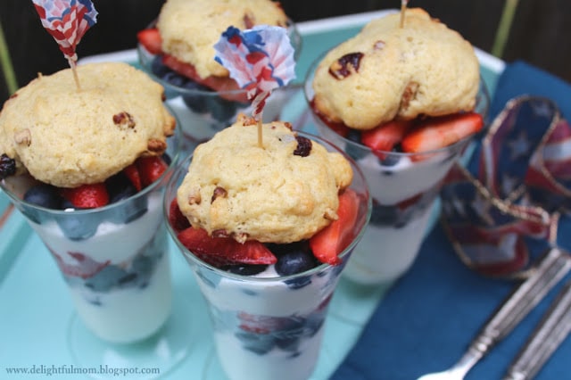fruit parfait with strawberries and blueberries and healthy scone on top
