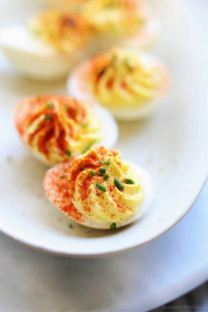 perfect recipe for deviled eggs easy made with hard boiled eggs filled with mustard egg yolk filling served on a plate