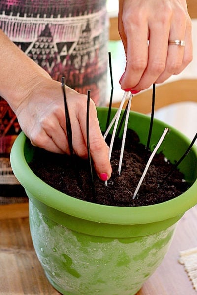oreo dirt cake in a pot with candles