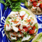 recipe for white fish ceviche served on a tostada with homemade guacamole