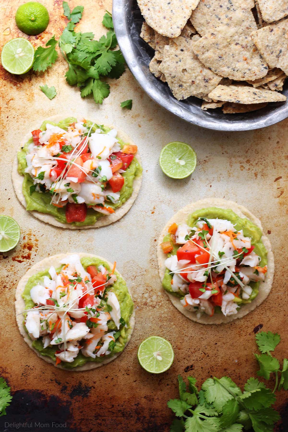 ceviche recipe made raw or cooked using halibut or cod fish served on a corn tortilla with guacamole on a plate