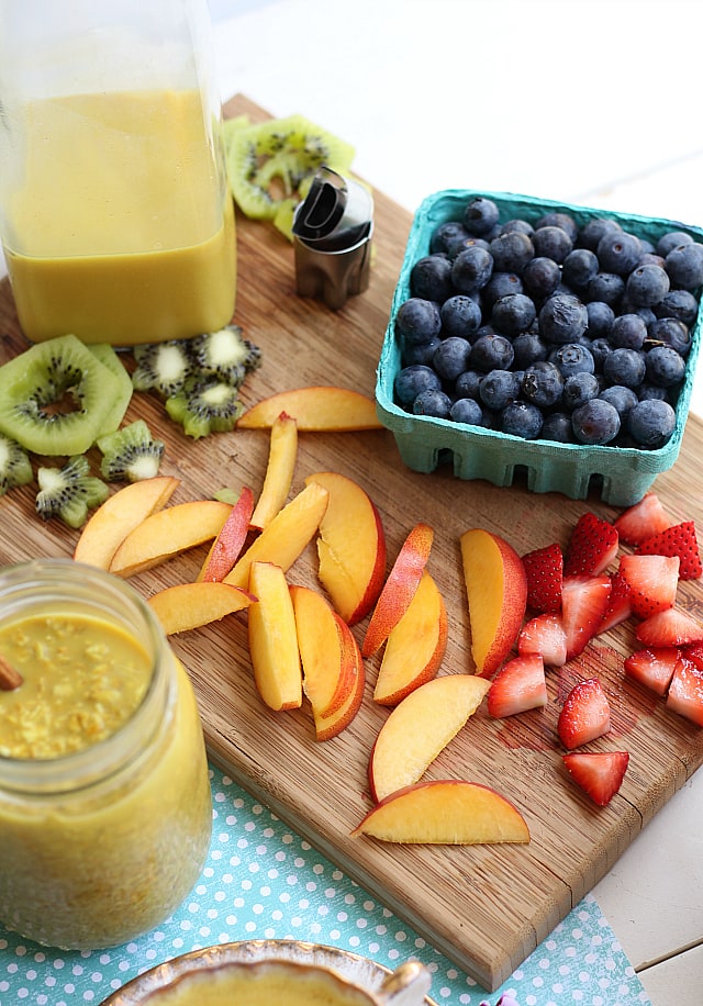 Fresh fruit on oatmeal with honey and turmeric