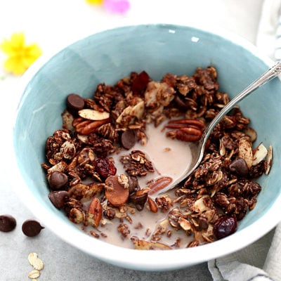 Transform mornings with this healthy chocolate granola recipe! Add your favorite nuts and dried fruit to this chocolate granola such as tangy dried cherries, chocolate chip morsels and pecans for a dreamy morning treat (vegan and gluten-free)!  #chocolate #granola #recipe #healthy #glutenfree #easy #vegan | recipe at delightfulmomfood.com