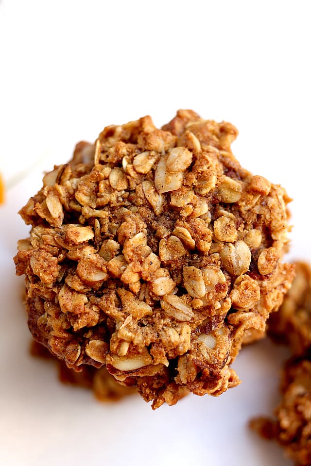 Close up of a chewy peanut butter oatmeal cookie showing the hearty oat texture.
