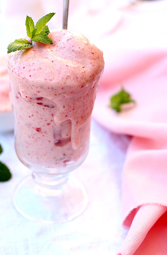 Sweetly delicious 3-Ingredient Nice Cream Recipe! Tastes like a creamy strawberry banana smoothie or ice cream without having to churn. Vegan and made with Bananas, Strawberries and Almond Milk!