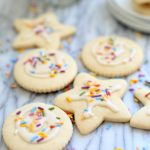 vegan gluten free sugar cookies cut out with icing and sprinkles