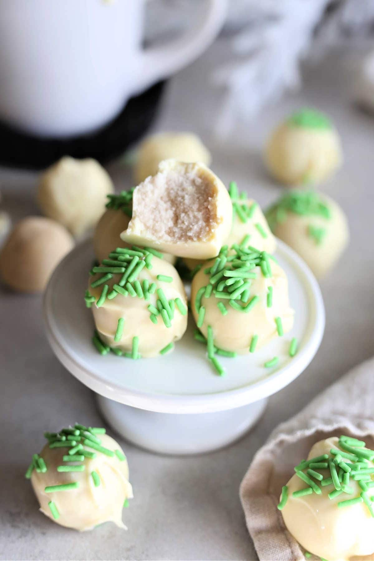 white chocolate sugar cookie dough truffles on a cupcake tray