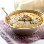 Comforting slow cooker vegan potato soup with white beans and kale. A hearty comfort food blended into creamy bliss.
