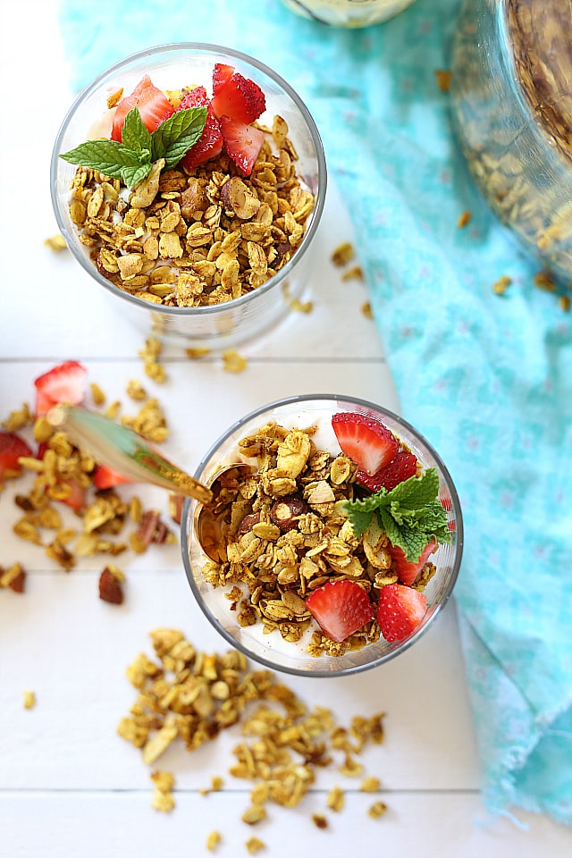 Crunchy turmeric granola parfait recipe that takes turmeric to a whole new delicious level! I love eating turmeric any way I can get it and this turmeric granola is one way my kids will eat it too!
