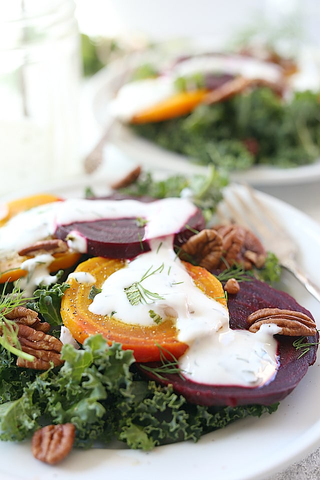 close up of golden and red beet kale salad with yogurt dressing