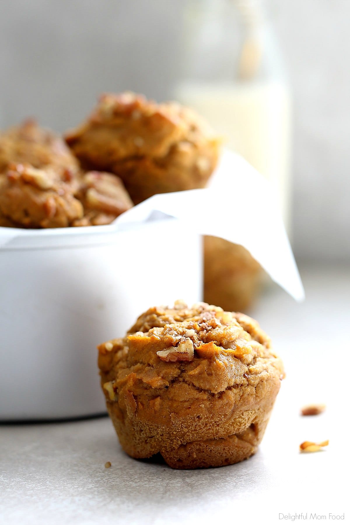 Gluten Free Pumpkin Muffins you will fall in love with and want to eat for days! Naturally dairy-free healthy muffins made with gluten free flours (with a grain free option), coconut sugar, pumpkin and comforting spices! #glutenfreepumpkinmuffins #pumpkinmuffins #baking #glutenfree #easymuffins #kidfriendly #pumpkin #dairyfreeglutenfree #dairyfree #snacks #breakfast #muffins | Recipe at Delightful Mom Food