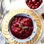 homemade cranberry sauce in a bowl with crackers