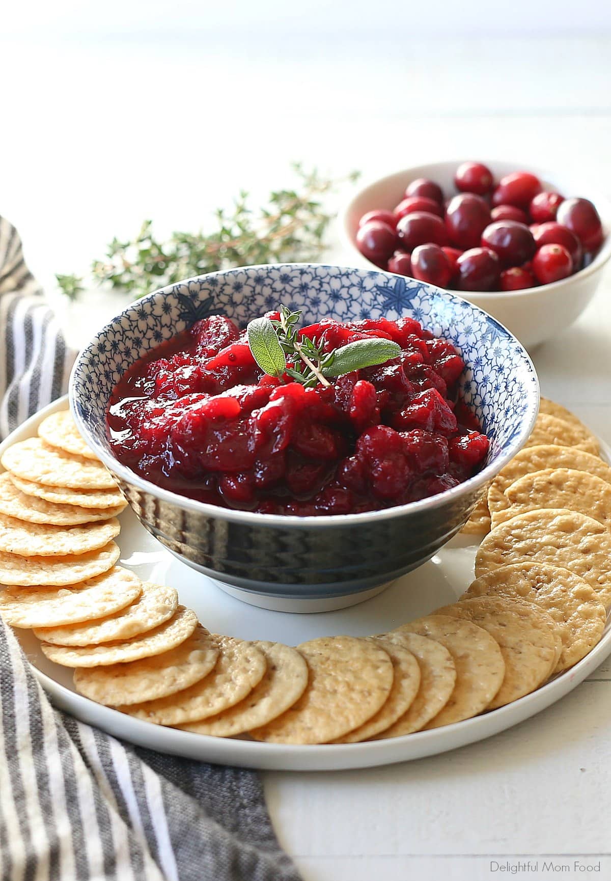 cranberry sauce recipe in a bowl with gluten-free rice crackers