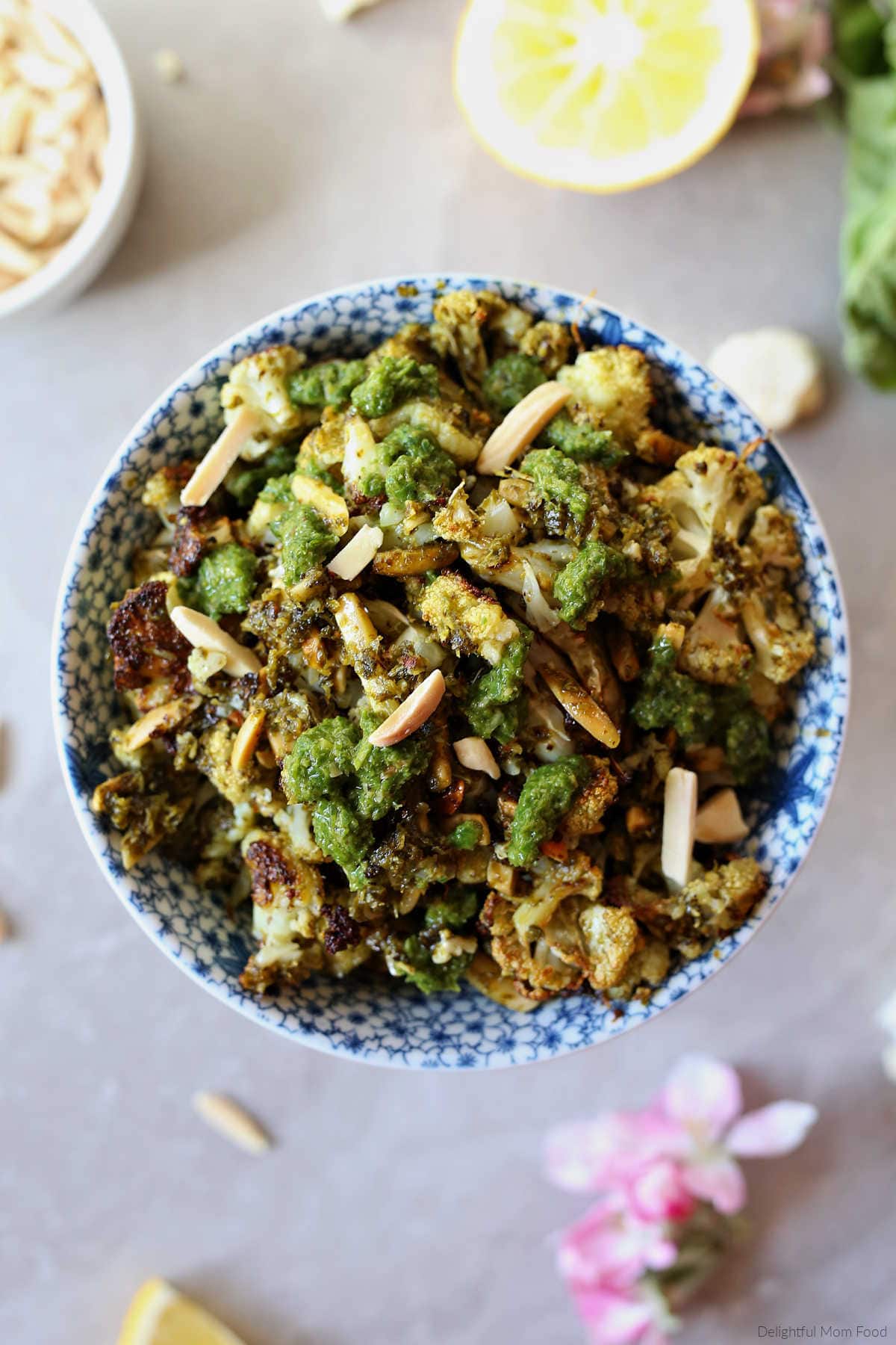 pesto, cauliflower, almond slivers roasted together and served in a bowl