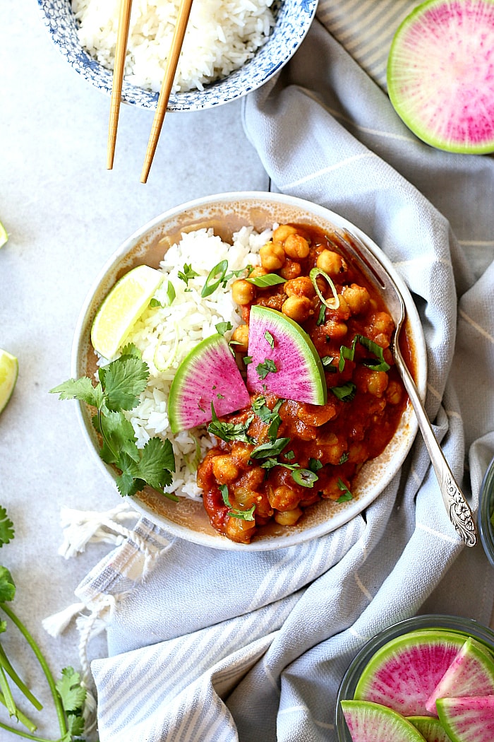 Chana Masala is an easy 30-minute healthy Indian recipe! This vegan and gluten-free chickpea dish is simmered in 1-pot with coconut curry spices and a tomato base. Toss this chana masala recipe with rice or serve with a side of roasted vegetables for an irresistible dinner! #vegan #chana #masala #easy #healthy #glutenfree #chickpeas #recipe | Delightfulmomfood.com
