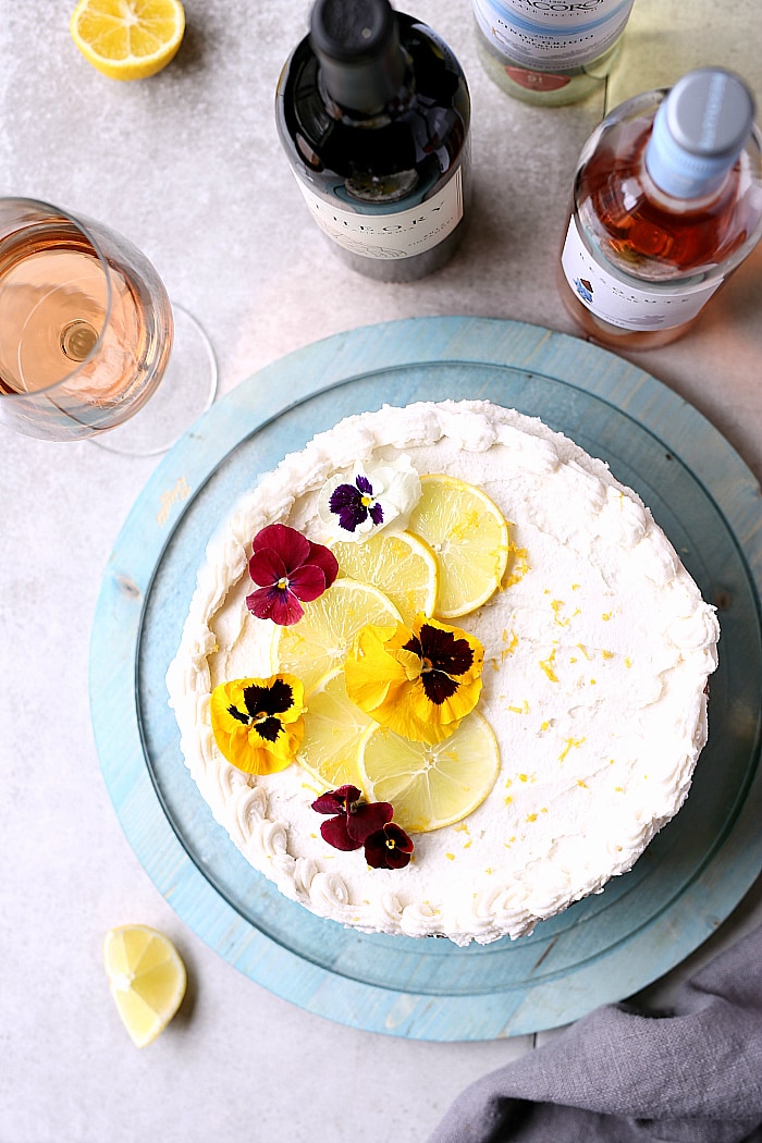 Lemon Yogurt Cake with natural refined sugar free coconut oil icing! An elegant citrus cake to bring to your next celebration. Pairs deliciously with a chilled glass of Rose or Pinto Grigio wine! #sponsored #lemon #cake #glutenfree #recipe #celebration #party | Recipe on delightfulmomfood.com