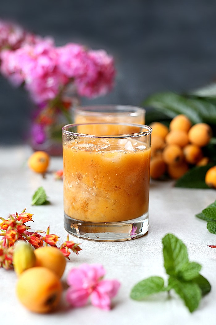 Fresh loquat cocktail recipe mixed in a blender and naturally made with tequila and a splash of sweet orange juice! #cocktail #drinks #recipe #loquat #tequila #glutenfree | Recipe at delightfulmomfood.com