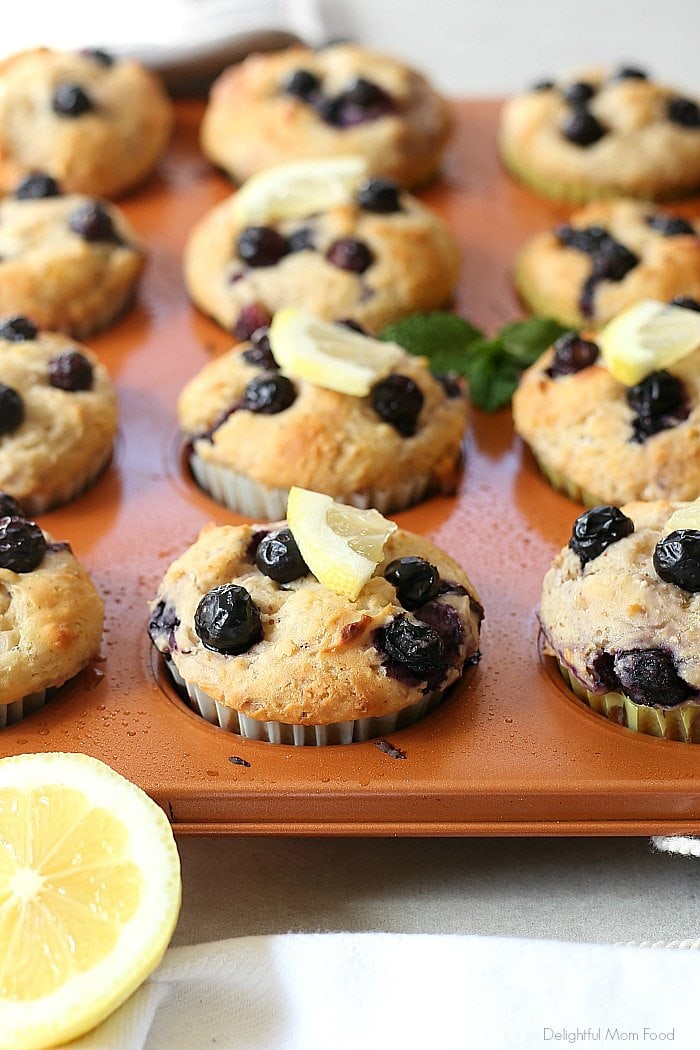 Light and healthy lemon blueberry yogurt muffins packed with Greek yogurt protein and whole food gluten-free ingredients! A delicious lemony muffin bursting with blueberry flavors! 