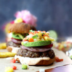 Easy grilled burgers topped with pineapple salsa and spicy aioli. Enjoy this juicy hamburger recipe at your next summer BBQ! These hamburgers are gluten-free and heated and cooked in as little as 7 minutes! #30minutemeals #easy #quick #hamburger #recipe #juicy #burger #grilled #glutenfree #pineapple #relish #salsa | Recipe at delightfulmomfood.com