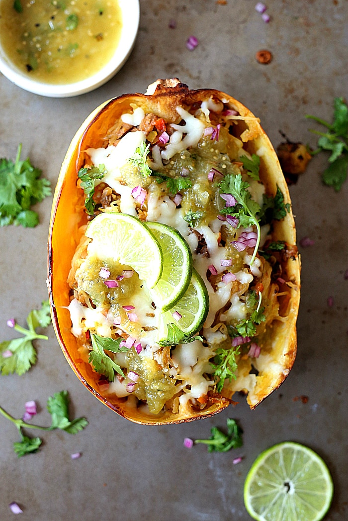 Healthy low carb spaghetti squash baked & stuffed with zesty Mexican mushroom salsa, roasted salsa verde, red onions, and cilantro gives this dish delicious flavors! It is vegan, gluten-free and low carb, catering to most diets. | #BLENDABELLA #zestymexican #ad #spaghettisquash #recipe #healthy #easy #quick #vegan #vegetarian #maindish #entree | Recipe at delightfulmomfood.com