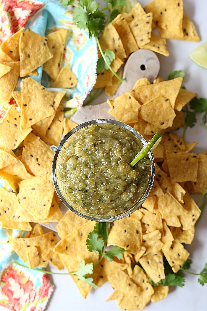 Roasted tomatillo salsa verde (green salsa) is bursting with Mexican flavors! Enjoy this puree of blistering tomatillos as a dip with chips or spread on top of your favorite enchiladas and burritos! #roasted #tomatillo #salsa #recipe #greensalsa #Mexican | Recipe at delightfulmomfood.com