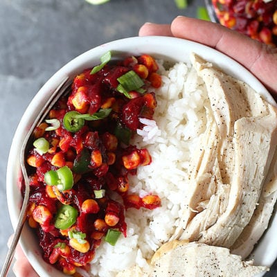 Tangy spicy cranberry salsa topped on rice and leftover turkey is bursting with roasted cranberry flavor! The salsa is a delightful addition to salads, tacos and added to holiday turkey dishes. #cranberry #recipe #healthy #salsa #ad #capecodselect #frozencranberries #cranberriesforallseasons #Thanksgiving #Christmas #holiday #food #glutenfree #dairyfree | Recipe at delightfulmomfood.com