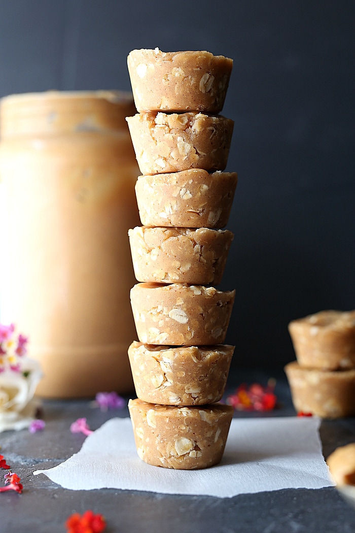 Peanut butter and oat cookie cups stacked high! Vegan and gluten-free recipe at delightfulmomfood.com