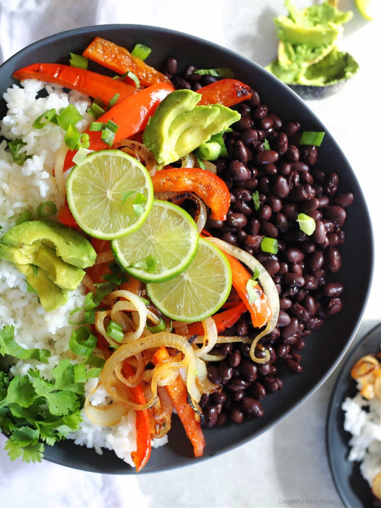 vegetarian fajita burrito bowl with beans rice peppers onion and cilantro