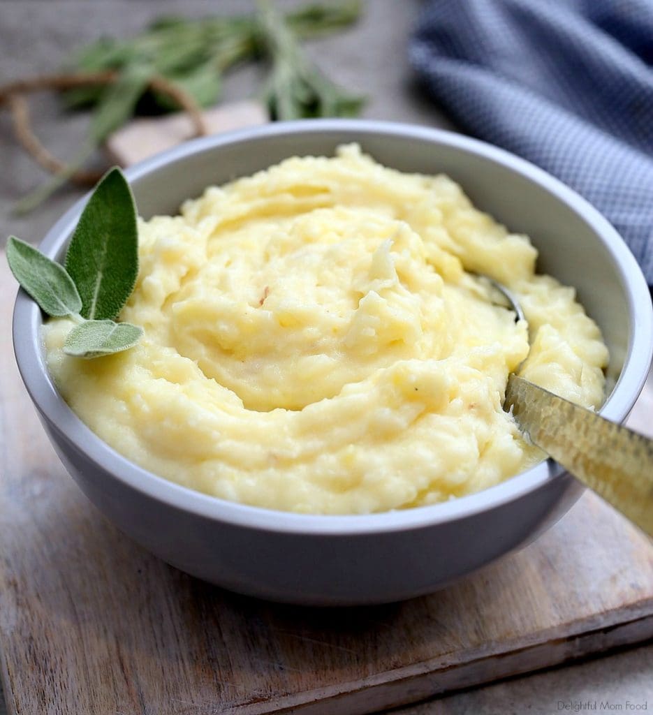 creamy garlic mashed potatoes garnished with sage leaves