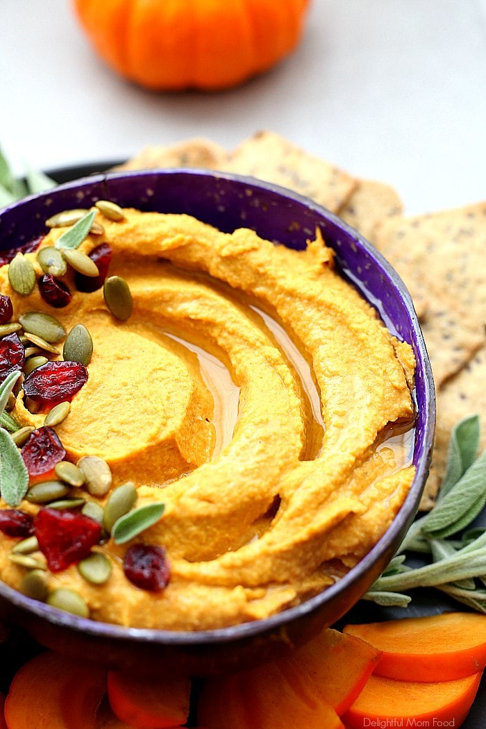It is everything pumpkin time! This pumpkin hummus is savory and creamy with hints of cinnamon, cumin and garlic in a tahini chickpea pumpkin puree base. #recipe #pumpkin #hummus #savory #healthy #holiday #Christmas #Thanksgiving #appetizer #glutenfree | Recipe at delightfulmomfood.com