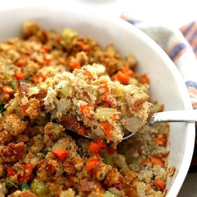 gluten-free stuffing made with carrots, celery, onion and gluten-free bread served on a spoon