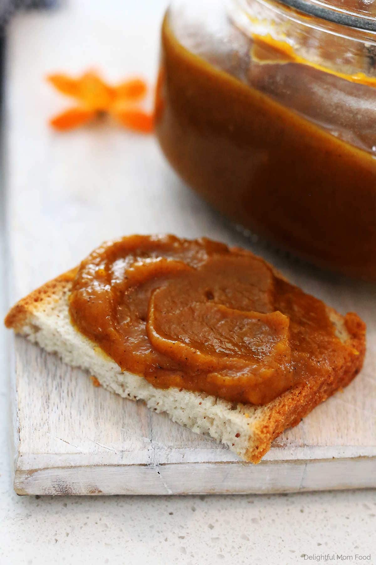 Pumpkin butter spread served on a slice of gluten-free bread.