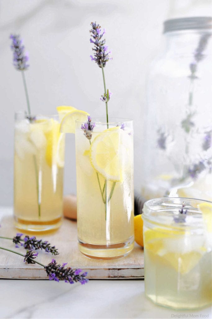 glasses filled with fresh homemade lavender lemonade, ice and lavender plant buds