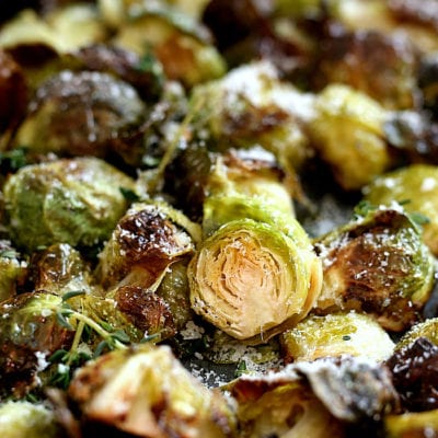 Oven roasted brussels sprouts tossed and baked in flavorful oil, salt and pepper. This easy side dish is gluten-free, vegetarian and for a bonus is delicious topped with freshly grated Parmesan cheese or nutritional yeast. #brusselssprouts #recipe #oven #roasted #quick #healthy #glutenfree #vegan #vegetarian #sidedish | recipe at delightfulmomfood.com