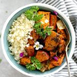 Savory roasted sweet potatoes, carrots and onion over cauliflower rice is a family favorite Buddha bowl ready in minutes! This Buddha bowl is deliciously packed with irresistible flavors and caters to most diets including gluten-free, Whole 30, Paleo and vegan! #glutenfree #buddhabowl #roasted #sweetpotatoes #carrots #sheetpan #easy #cauliflowerrice #whole30 #vegan #vegetarian | Recipe at delightfulmomfood.com