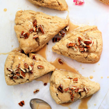 the best gluten free scones recipe topped with pecans on parchment paper with a spoon