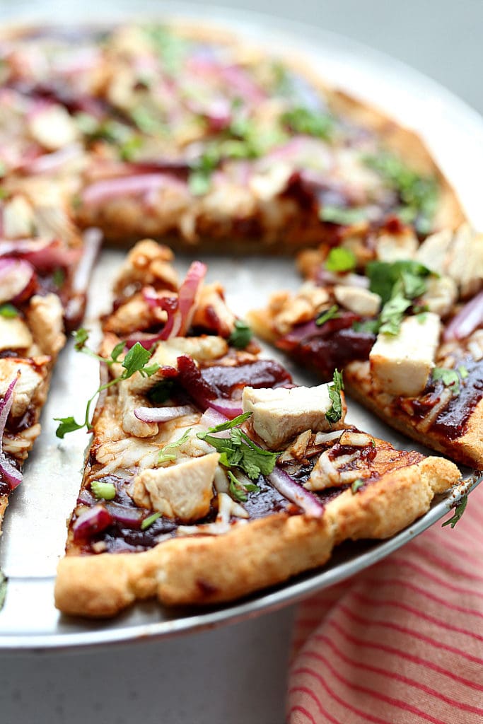 gluten free pizza with barbecue sauce on top, chicken and cilantro