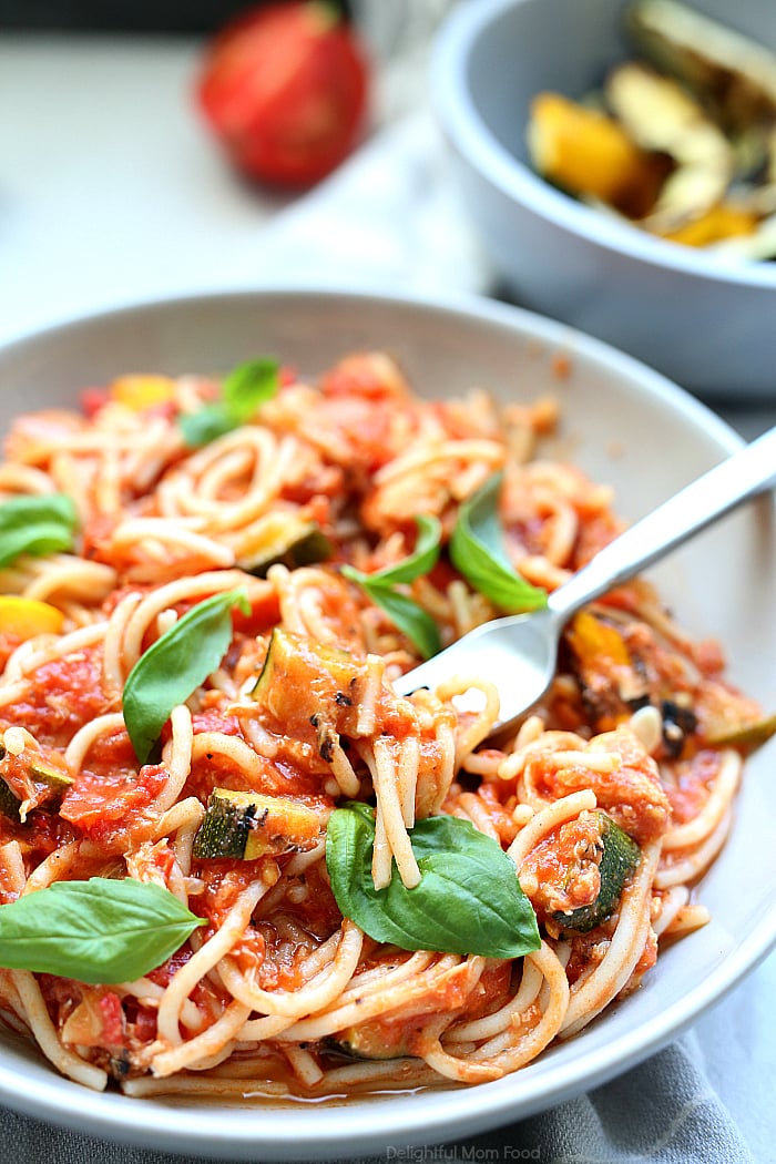 Use up fresh zucchini, yellow squash and juicy plum tomatoes in this mouthwatering healthy spaghetti recipe! This gluten-free summer pasta doesn't compare to other spaghetti! #healthy #summer #pasta #spaghetti #glutenfree #recipe #zucchini #squash #main #dinner | recipe at Delightful Mom Food