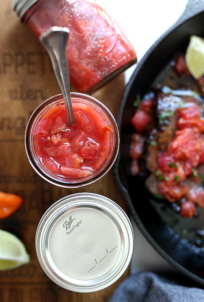 This plum habanero salsa is a wonderful way to use up seasonal plums and juicy tomatoes! It is a little bit of sweet and spicy wrapped up into one delicious salsa! Top it on tacos, burgers, salads and pork chops! #sponsored #plum #habaneros #salsa #recipe #canning #pressurecanning #plumsalsa #BallProudlyHomemad | Recipe at Delightful Mom Food