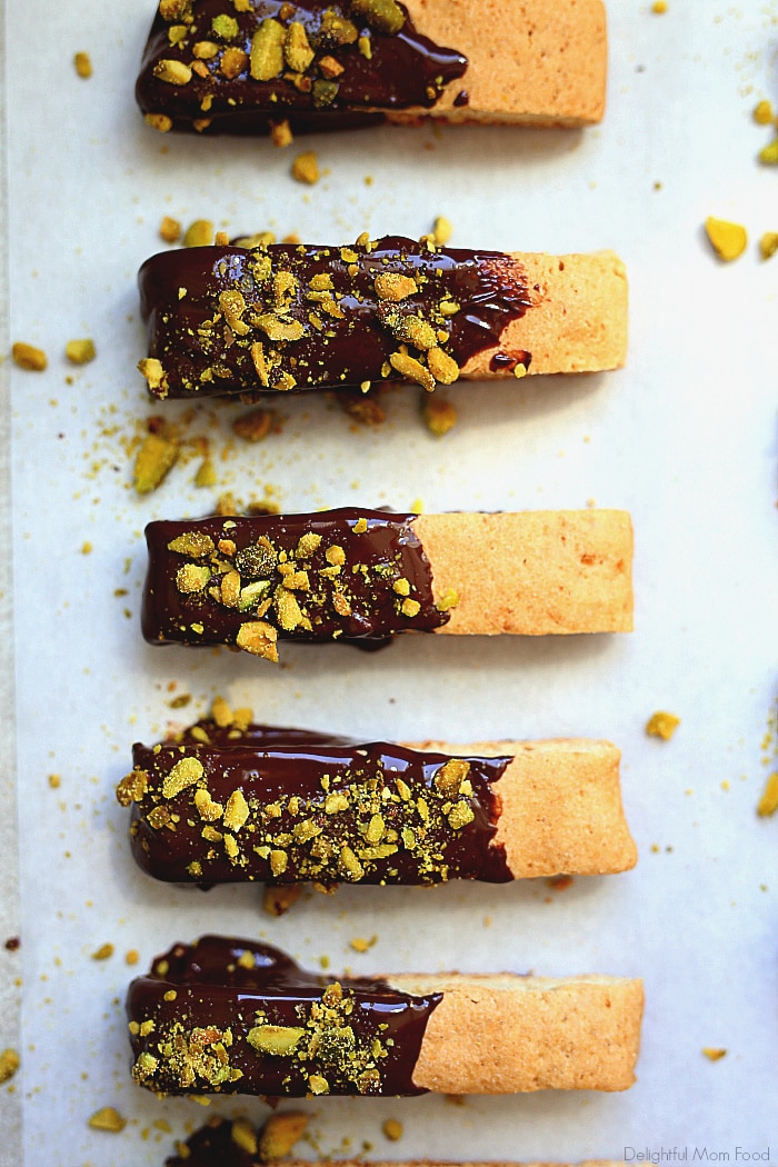 Wholesome gluten-free biscotti cookie recipe topped with dairy-free chocolate and crunchy pistachios to sooth a cookie craving! Fabulous to enjoy for your next tea party or holiday cookie exchange.  #glutenfree #cookie #cookies #recipe #dairyfree #biscotti #dessert #treats #sweets #wholesome | Delightful Mom Food