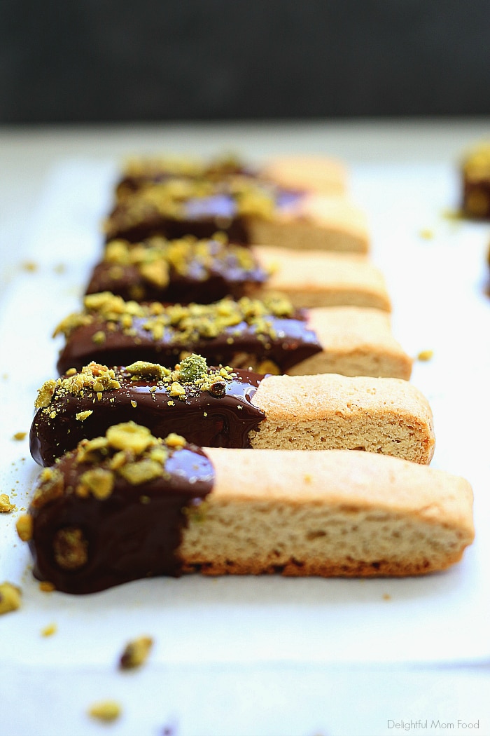 Wholesome gluten-free biscotti cookie recipe topped with dairy-free chocolate and crunchy pistachios to sooth a cookie craving! Fabulous to enjoy for your next tea party or holiday cookie exchange.  #glutenfree #cookie #cookies #recipe #dairyfree #biscotti #dessert #treats #sweets #wholesome | Delightful Mom Food