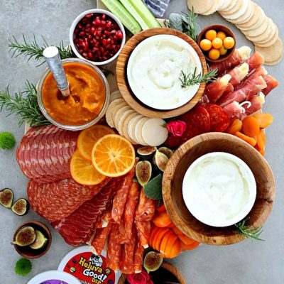 Celebrate and host a party with this Charcuterie board! This winning Charcuterie platter is loaded with meats, dried fruit, the perfect dips, gluten-free crackers and tips on how to make the perfect holiday Charcuterie board- the greatest focal point to every party!  #charcuterieboard #charcuterie #glutenfree #recipe #wholesome #appetizer | Recipe at Delightful Mom Food