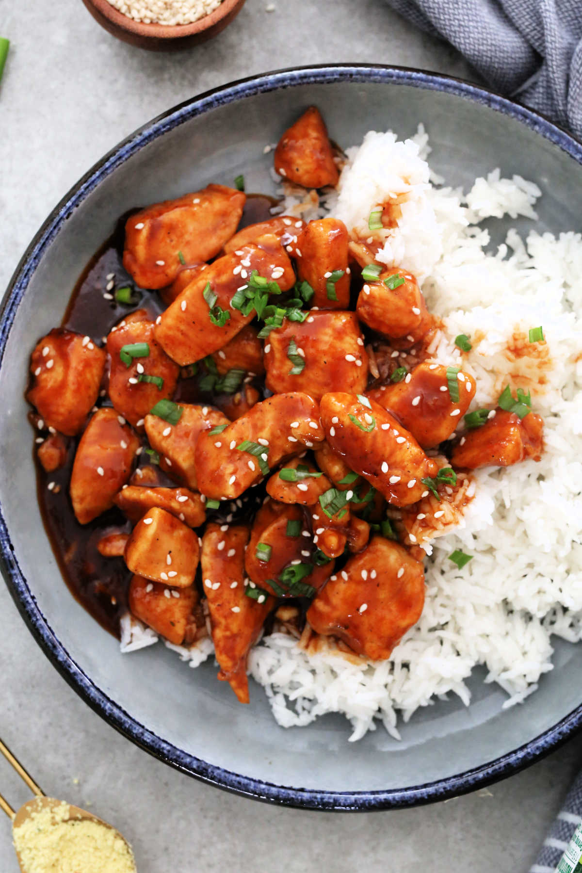 Chinese chicken in sweet and sour sauce with rice on a plate