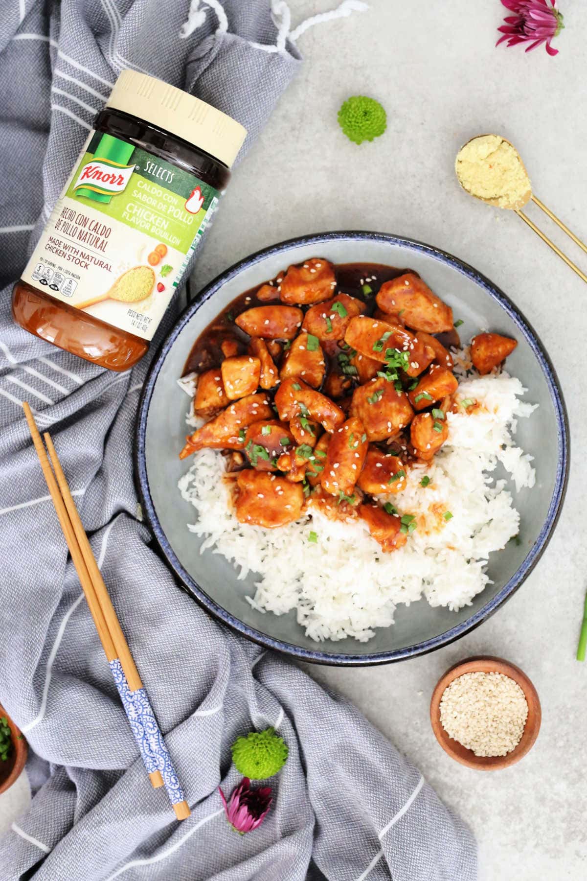 easy sweet and sour chicken recipe over white rice on a plate