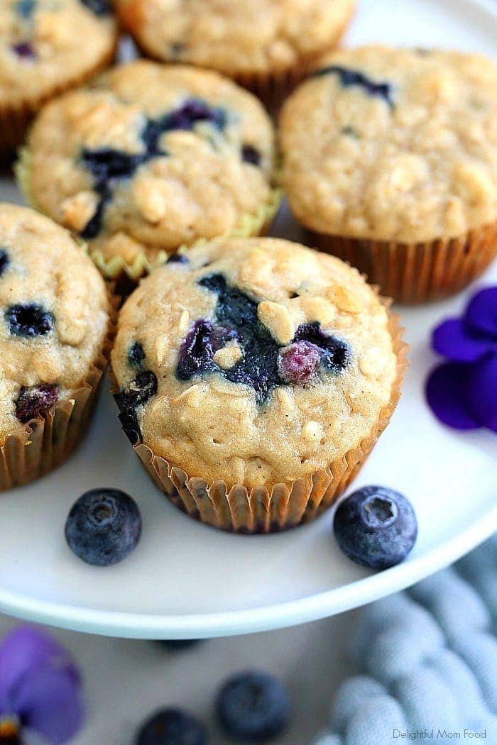 The fluffiest gluten free blueberry muffins recipe! These healthy and easy blueberry oat muffins are seriously the best gluten-free muffins! They are also dairy-free and packed with fiber, juicy blueberries, rolled oats and a hint of lemon zest. #glutenfree #muffins #recipe #healthy #oats #oatmeal #breakfast #brunch #snack #baking #dairyfree #blueberry #blueberries #delightfulmomfood | Recipe at Delightful 