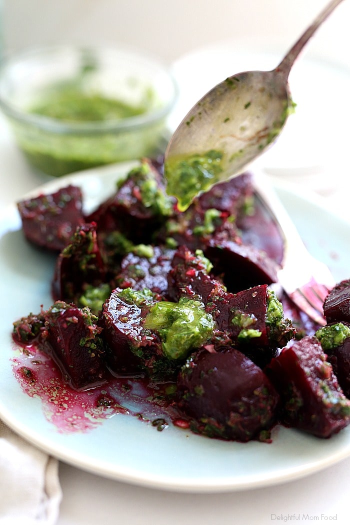 Easy Roasted Beet Salad with Zesty Herb Vinaigrette Dressing is a delectable salad served with a thyme, parsley and basil vinaigrette dressing. This simple salad is all about just beets roasted as a side salad yet can also be served over fresh arugula leaves and goat cheese to transform into a main dish. #roastedbeets #beetsalad #salad #sidedishes #healthy #glutenfree #vegan #recipe #herbdressing #dressingforbeets #beetrecipes | Recipe at Delightful Mom Food