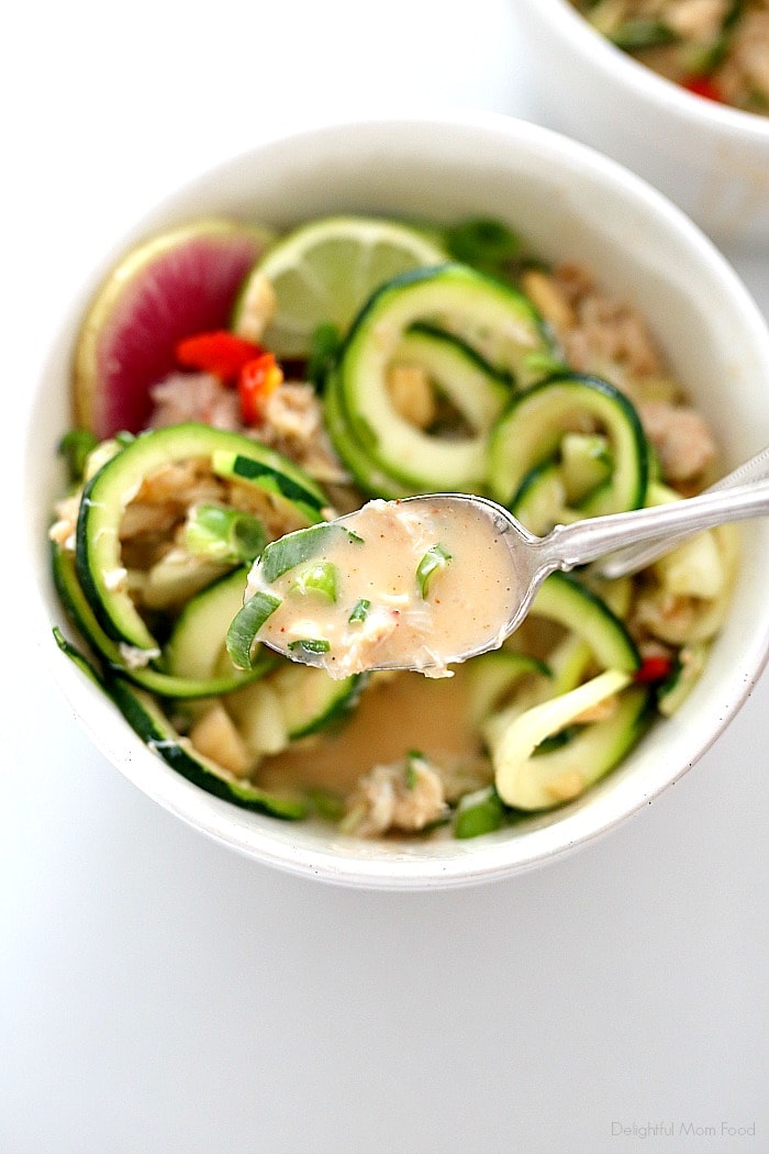 Zesty Thai coconut lime sauce makes this one amazing seafood zucchini pasta bowl (zoodles)! Made with zucchini pasta, crab meat, and cashews tossed in a sweet and spicy lemongrass, coconut milk based sauce for a low carb, gluten-free and dairy-free pasta meal! #healthy #zucchinipasta #zucchinipastabowl #healthydinner #seafood #crabmeat #thaicoconutbowls #dairyfreezucchinipasta #glutenfreebowls #glutenfree | Recipe at Delightful Mom Food