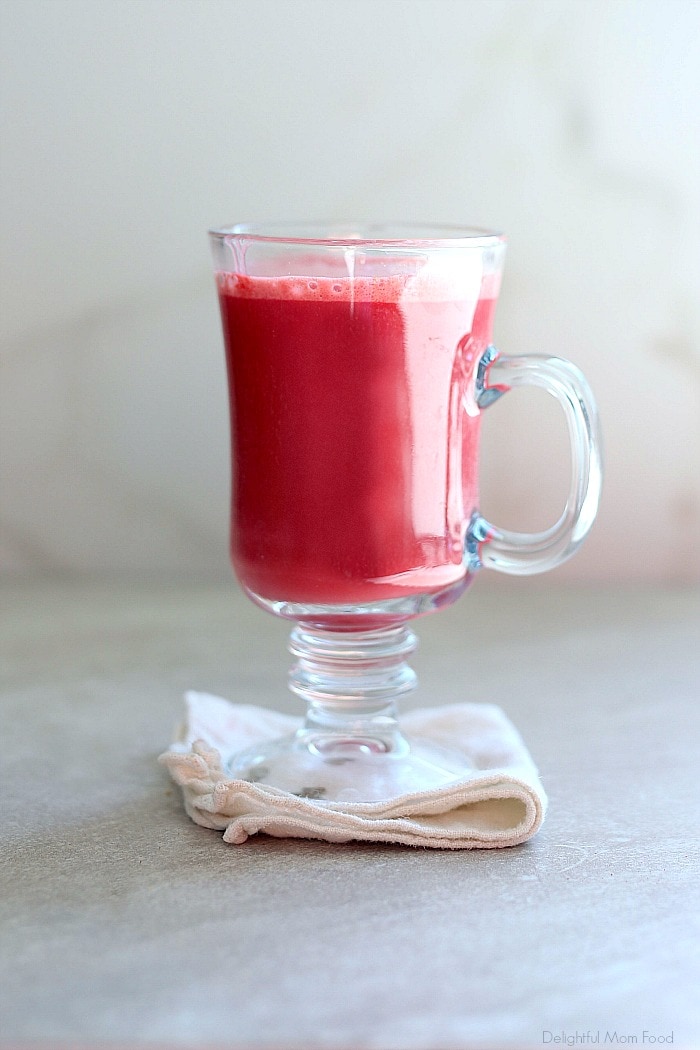 Vegan Beet latte colored pink with beet powder! It is a delicious nutritional way to get extra nutrients into your everyday latte. Simply enjoy this sweet treat any time of day for a blood cleansing and afternoon detox drink. #veganlatte #beverage #drink #beetrecipe #dairyfree #healthy #ValentinesDay #holiday #Christmas #drink | Recipe at Delightful Mom Food