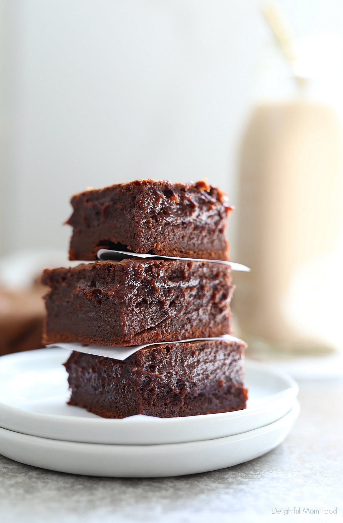 Extra fudgy coconut oil brownies! This is by far the BEST gluten-free brownie recipe with a rich chocolate center that melts in your mouth! These easy brownies take little time to whip up and are a crowd-pleaser every time! #coconutoilbrownies #dessert #treats #sweets #brownie #recipe #easy #quick #glutenfreebrownierecipe #dairyfreedessert #delightfulmomfood | Recipe at Delightful Mom Food