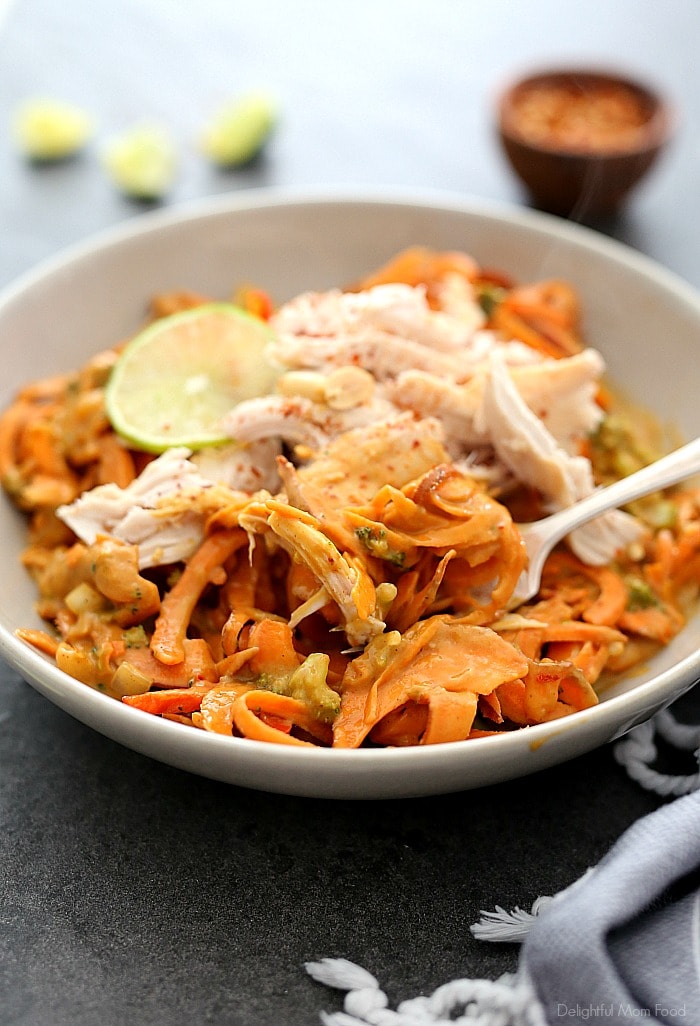 Spicy sweet potato pasta in a creamy red chili and broccoli peanut sauce and tossed with rotisserie chicken that comes together quickly at moments notice. Peanut, ginger, soy, and garlic are what make this spicy sweet potato pasta recipe spectacular! It’s bursting with delicious Asian flavors you’d expect from a Chinese restaurant without the excess fat or expense. #sweetpotatopasta #sweetpotatorecipe #sweetpotato #noodles #zoodles #recipe #dinner #glutenfreepasta | Recipe at Delightful Mom Food